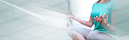 Woman doing yoga at home; panoramic bannerの写真素材
