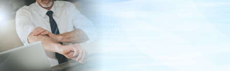 Businessman rolling up his sleeves; concept of motivation; panoramic banner