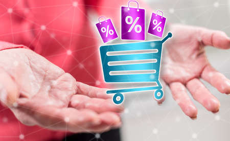 Discount concept above the hands of a woman in backgroundの写真素材