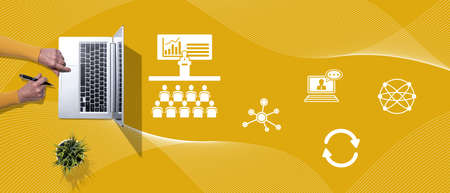 Top view of hands using laptop with symbol of teaching conceptの写真素材