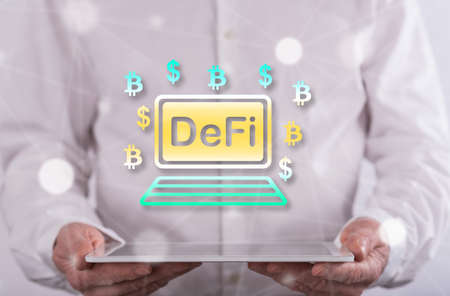 Defi concept above a tablet held by a man in backgroundの写真素材