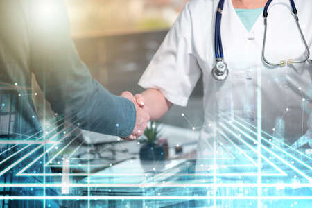 Female doctor shaking hands with her patient; multiple exposure