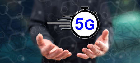 5g concept above the hands of a man in backgroundの写真素材