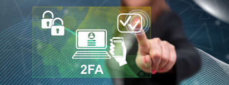 Woman touching a 2fa concept on a touch screen with her fingerの写真素材