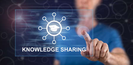 Man touching a knowledge sharing concept on a touch screen with his finger