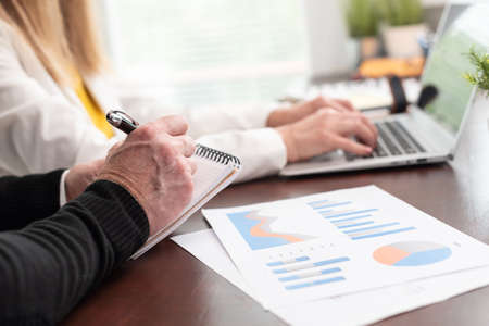 Two business people working together in office