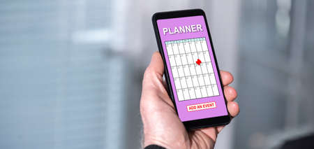 Smartphone screen displaying an event adding on planner conceptの写真素材