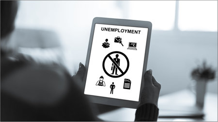 Tablet screen displaying an unemployment conceptの写真素材
