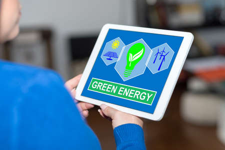 Tablet screen displaying a green energy conceptの写真素材