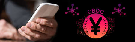 hand holding mobile phone with cbdc concept on background