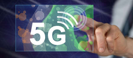 Man touching a 5g concept on a touch screen with his fingerの写真素材