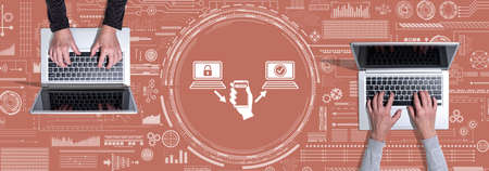 Top view of hands using laptop with symbol of 2fa concept