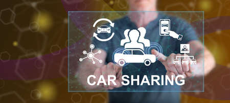 Man touching a car sharing concept on a touch screen with his fingers