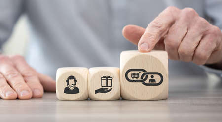 Wooden blocks with symbol of customer loyalty conceptの写真素材