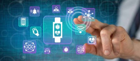 Man touching a wearable technology concept on a touch screen with his finger