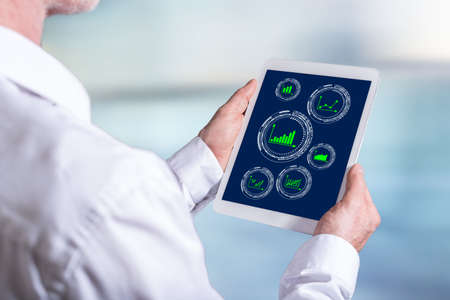 Tablet screen displaying a graphical analysis conceptの写真素材