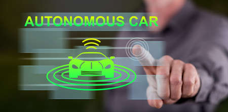 Man touching an autonomous car concept on a touch screen with his finger