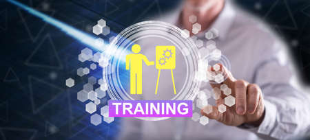 Man touching a training concept on a touch screen with his finger
