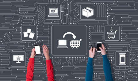 Top view of hands using mobile phone with symbol of e-commerce concept