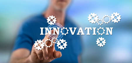 Man touching an innovation concept on a touch screen with his fingerの写真素材