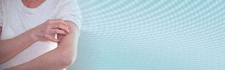Woman having itchy and scratching her arm. allergy symptoms; panoramic banner