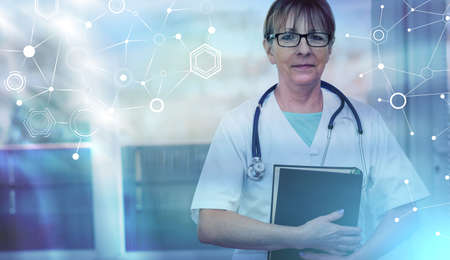 Portrait of female doctor standing and holding a medical textbook; light-effect