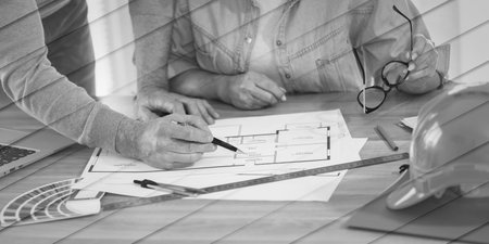 Architects working on blueprint of new construction project, geometric patternの写真素材
