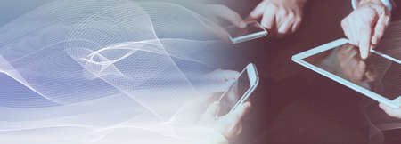 View of people hands using mobile phones and digital tablet; panoramic banner