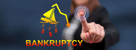 Woman touching a bankruptcy concept on a touch screen with her finger