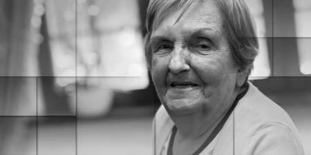 Portrait of a smiling elderly woman, geometric pattern