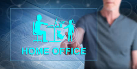 Man touching a home office concept on a touch screen with his finger