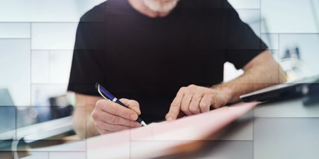 Senior man working in office, hard light effect, geometric pattern