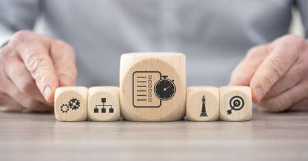 Wooden blocks with symbol of action plan conceptの写真素材