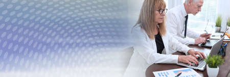 Businesspeople working together in office; panoramic banner