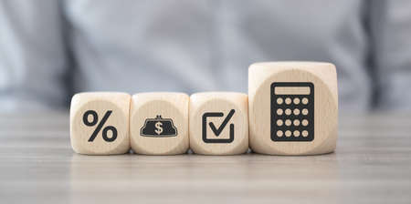Wooden blocks with symbol of accounting conceptの写真素材