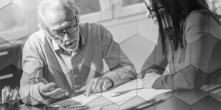 Businesspeople working together in office, geometric patternの写真素材