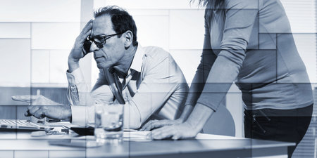 Coworkers having a business discussion in office, geometric pattern