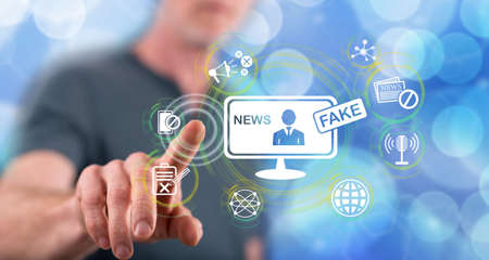 Man touching a fake news concept on a touch screen with his finger