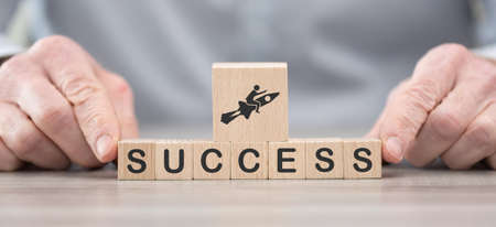 Wooden blocks with symbol of success conceptの写真素材