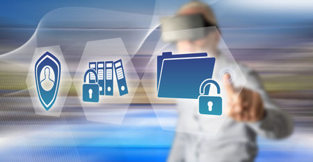 Man with vr headset touching a confidential data concept on a touch screen with his fingerの写真素材