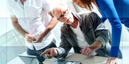 Business people working together in office, geometric patternの写真素材