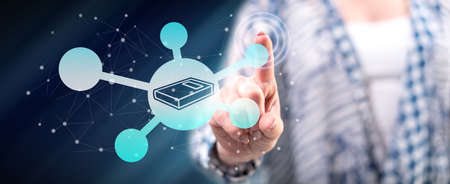 Woman touching a knowledge sharing concept on a touch screen with her finger