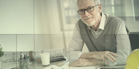 Portrait of senior architect sitting in office and looking at the camera, geometric patternの写真素材