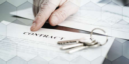 Realtor showing a contract with his finger, geometric patternの写真素材