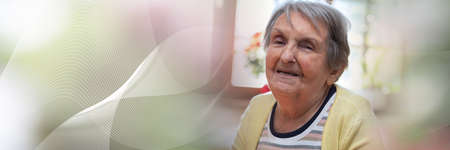 Portrait of a smiling elderly woman; panoramic banner