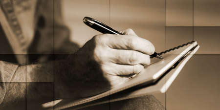 Male hands taking notes on a notebook, geometric patternの写真素材
