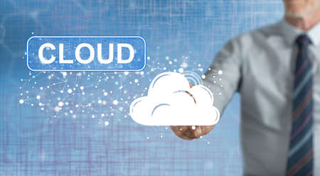 Man touching a cloud concept on a touch screen with his finger