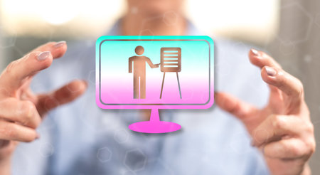 Online school concept between hands of a woman in backgroundの写真素材