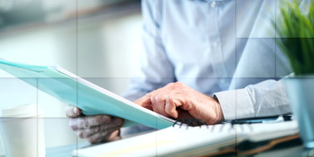 Businessman checking a document in office, geometric pattern