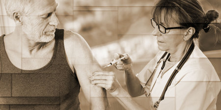 Female doctor injecting vaccine to senior man, geometric patternの写真素材